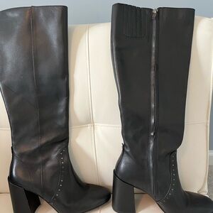 Women’s tall Coach boots with high heels.
